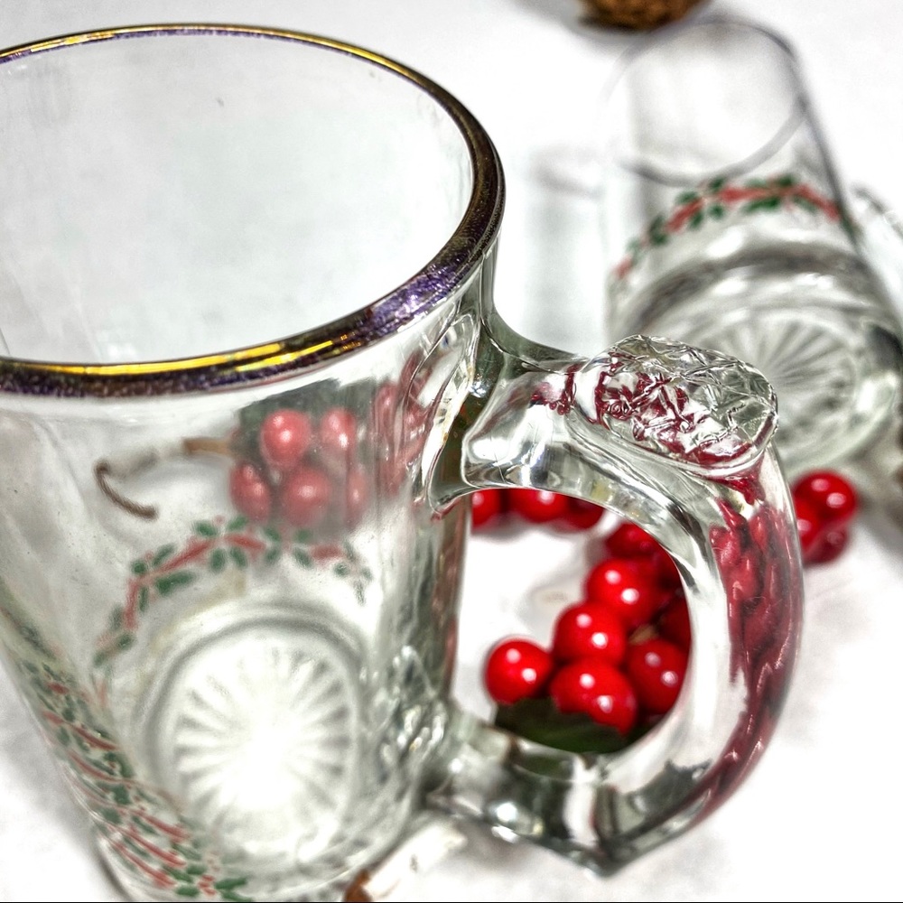 Two heavy glass Holiday mugs. Sold as a set.